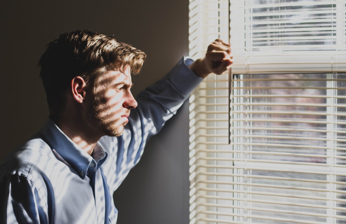 image of a man by a window