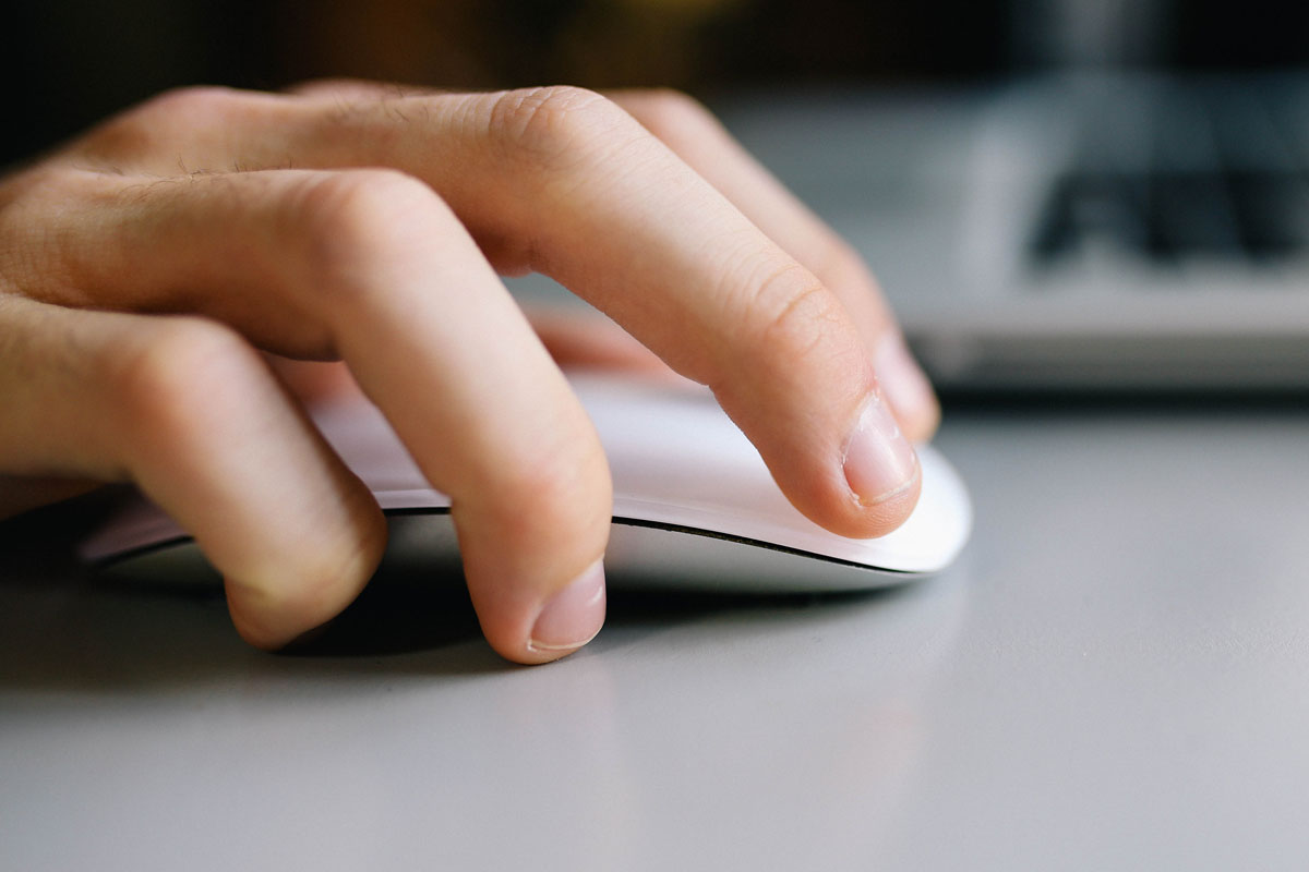 image of a hand using a computer mouse